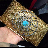 Gold plated clutch.