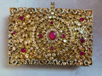 Gold plated clutch.